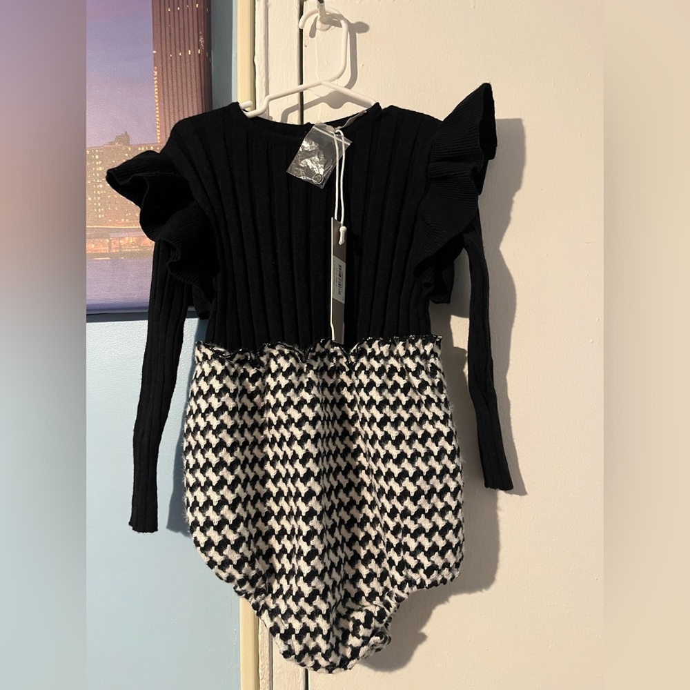 One Child. NWT Body suit for toddler girls in black and white in size 3. NWT